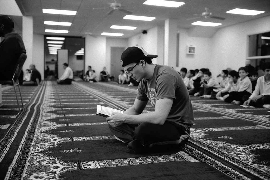 6. Student Reading Qur’an, Islamic Society of Wichita, Wichita, KS, gelatin silver photograph, 16”x20” (2011)