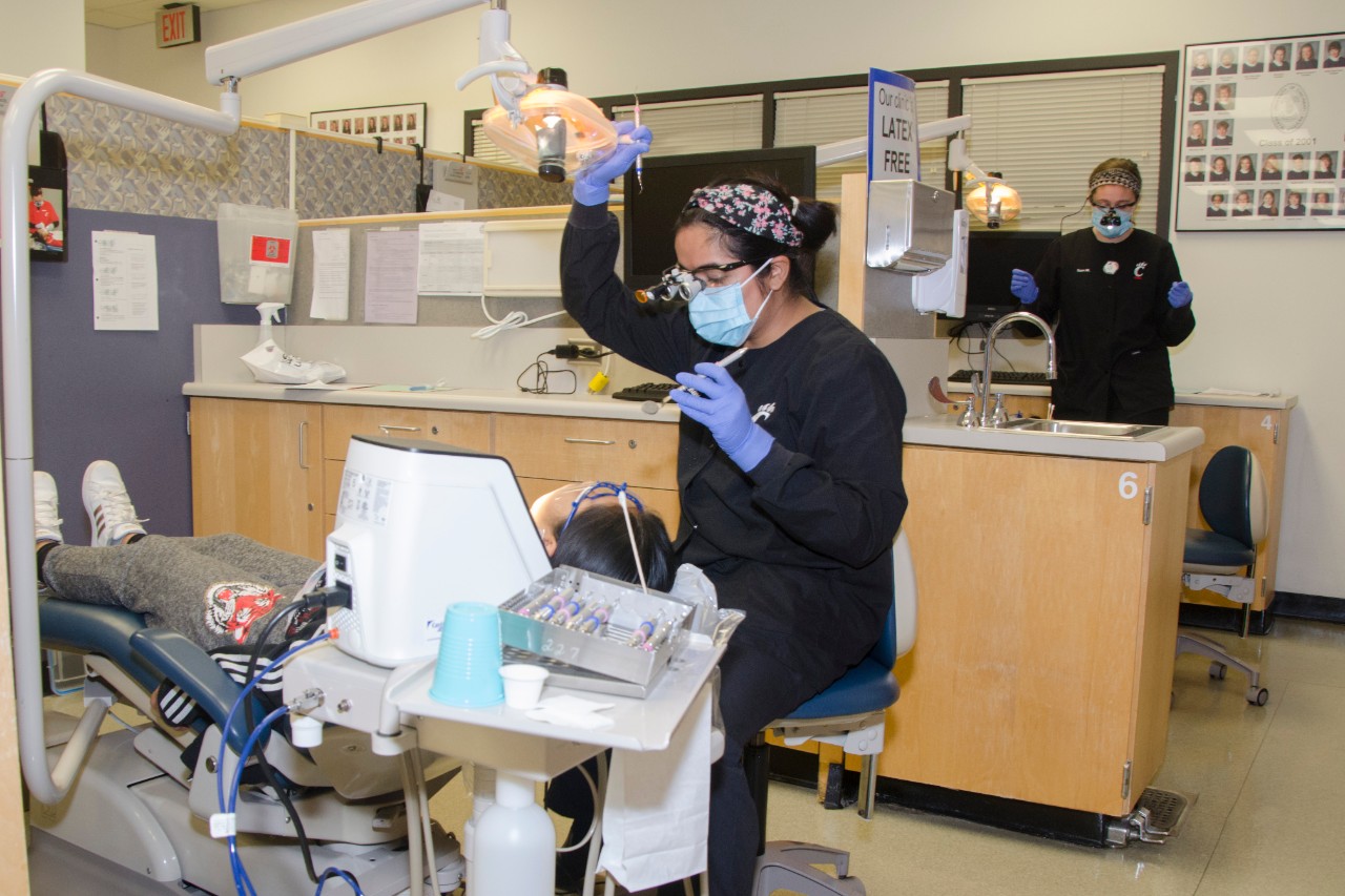 Dental Hygiene student working in clinic 