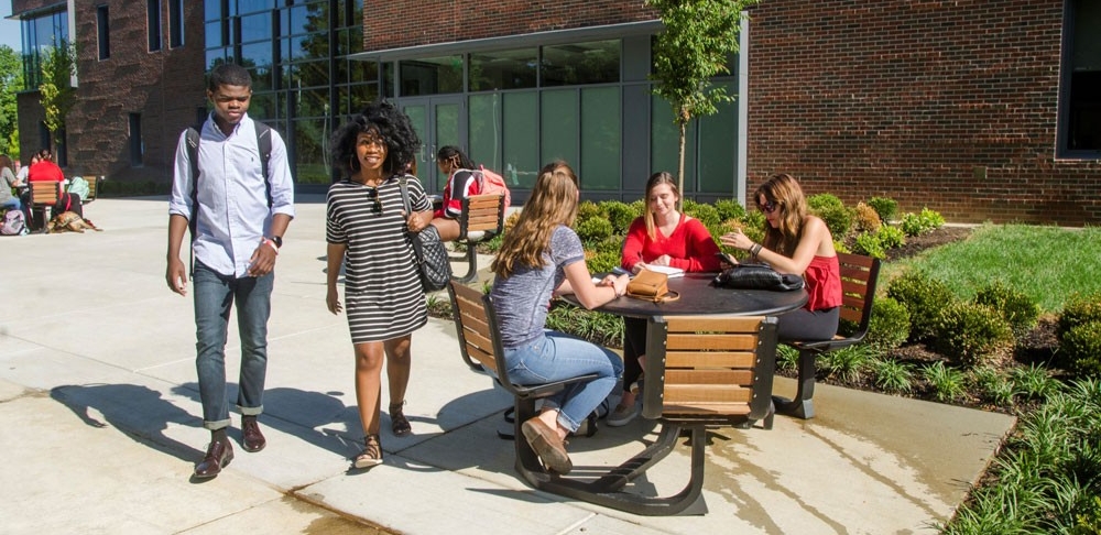 Students walking outside Progress Hall at UC Blue Ash College