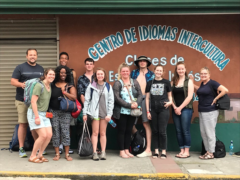 Students and faculty chaperones posing together in Costa Rica