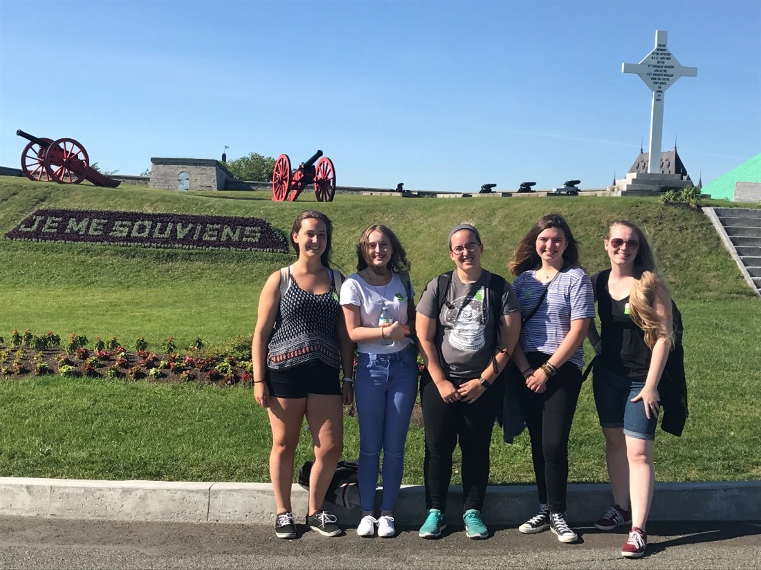 students posing in front of building in Quebec