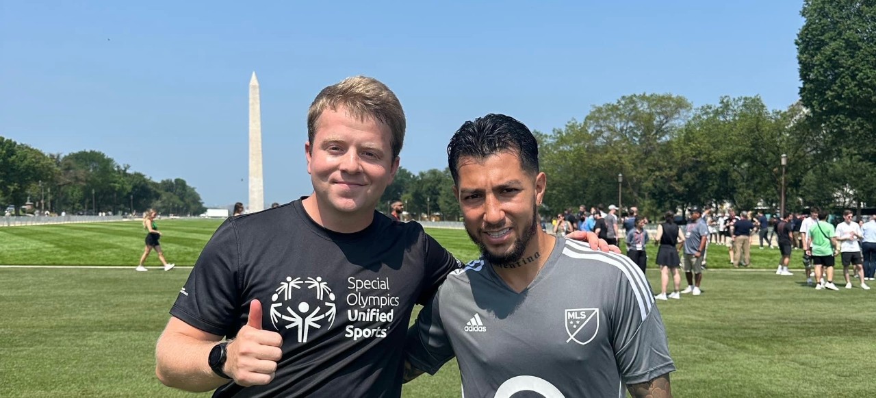 two men posing near Washington monument