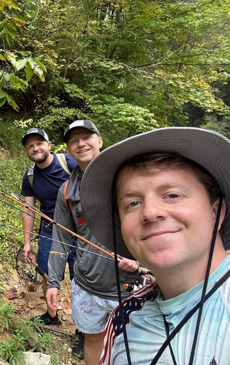 three men with fishing poles