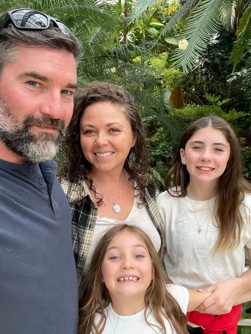 family of four people at garden