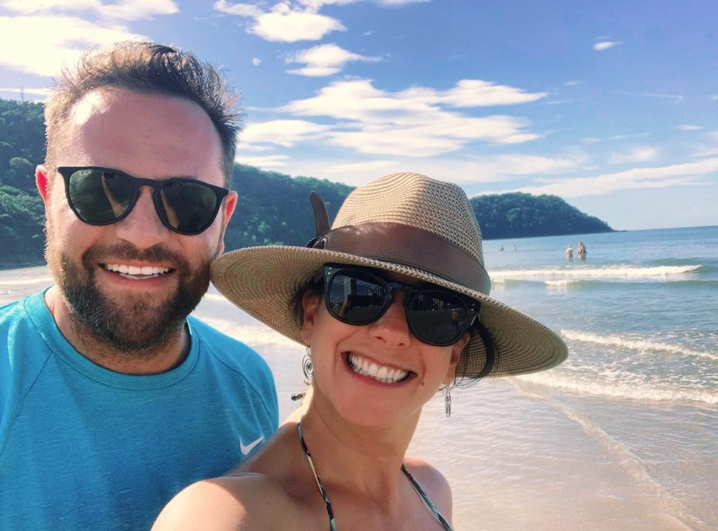 Carolina with her husband Matthew on beach