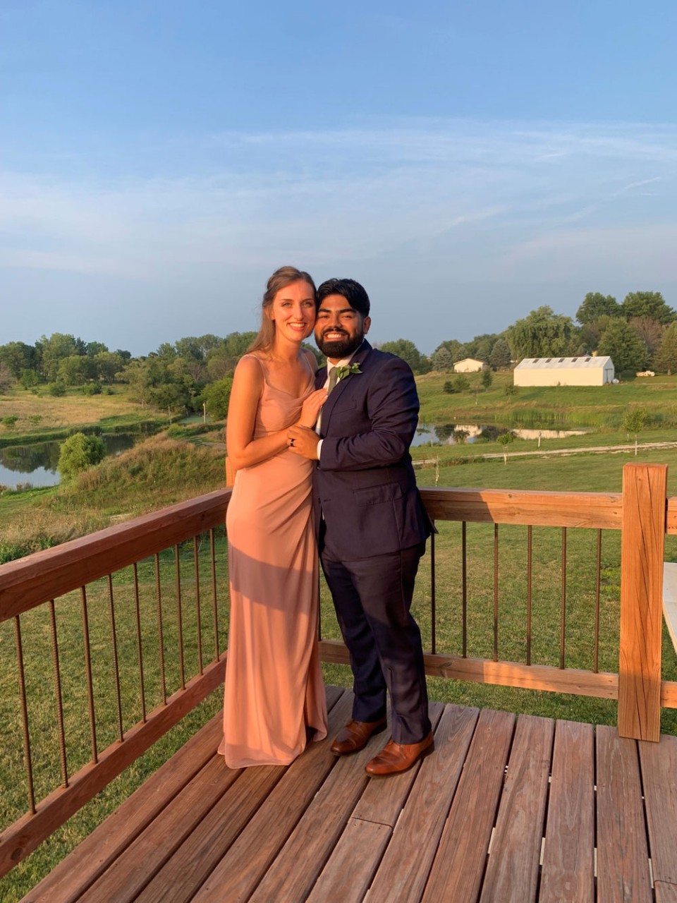couple standing on outdoor deck