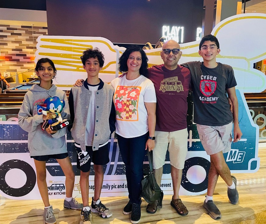 Family of five posing at an event